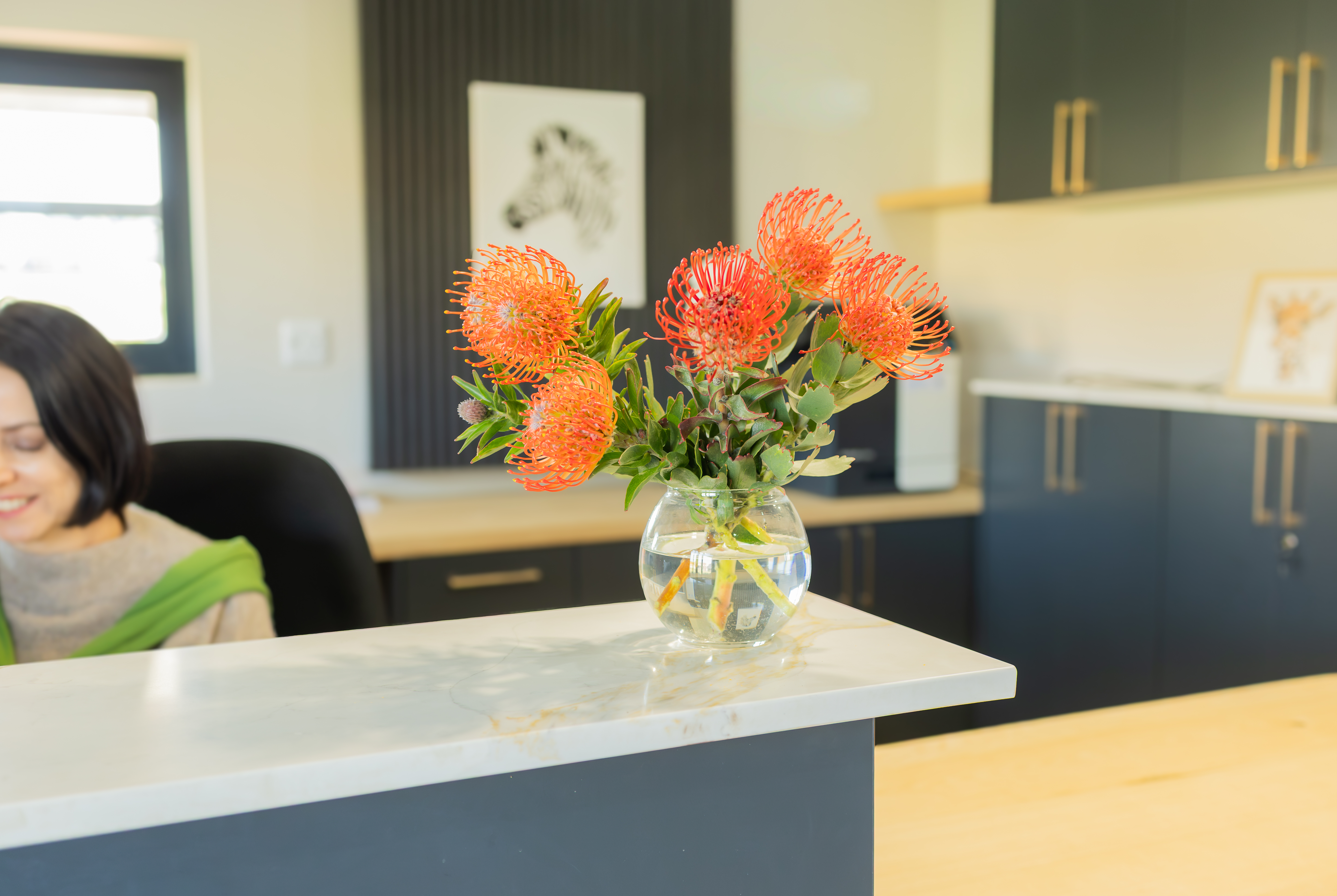 King's College reception desk with flowers