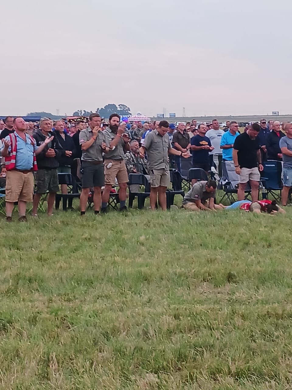 Men gathered at dusk